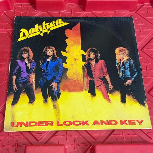 Dokken under lock - under, and